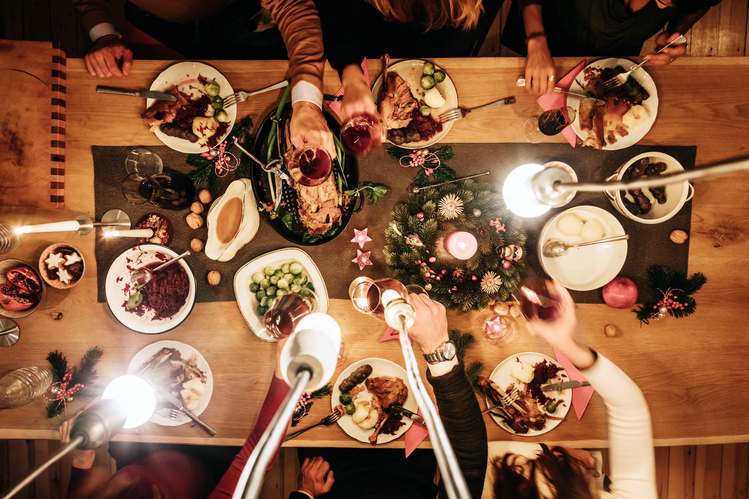 Overhead view of friends eating traditional christmas meal